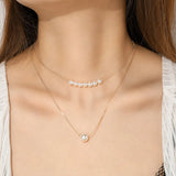 Élégant collier à double rang de perles
