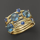 Bague vintage en or avec cristaux bleus superposés