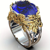 Bague vintage en argent avec feuille dorée et verre bleu