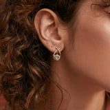 Boucles d'oreilles Golden Cross™ | Élégance en zirconia