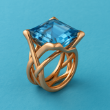 Bague vintage en or rose avec zircone bleue