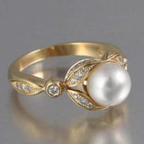 Bague vintage en or brillant et perles