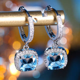 Boucles d'oreilles vintage carrées en verre bleu