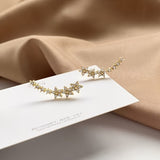 Boucles Florales™ | Élégance intemporelle en or