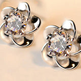 Boucles d'oreilles vintage en argent brillant en forme de fleur