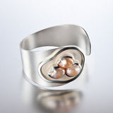 Bague vintage en argent avec nid de perles