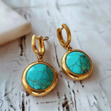 Boucles d'oreilles vintage en or incrustées de pierres bleues