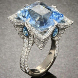 Bague vintage exquise en cristal bleu et zircone argentée