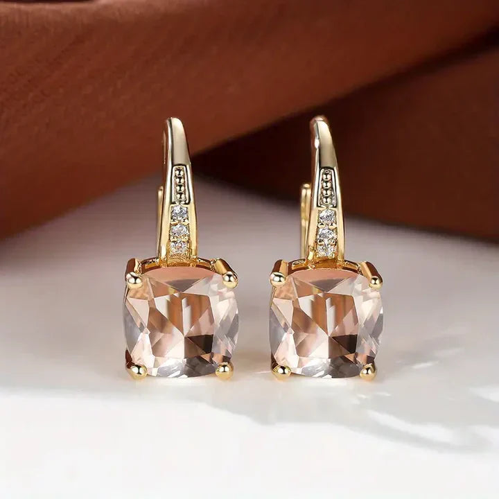 Boucles d'oreilles créoles en or avec pierres mystérieuses
