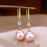 Éclat d'Or™ | Boucles d'oreilles dorées en matière raffinée