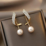 Boucles d'oreilles™ | Élégance en perles dorées