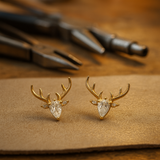 Boucles d'oreilles en forme de bois avec zircone transparente