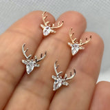 Boucles d'oreilles en forme de bois avec zircone transparente