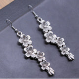 Boucles d'oreilles pendantes florales bohèmes en argent