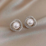 Boucles d'oreilles spirales argentées avec perles
