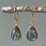 Boucles d'oreilles vintage en or avec pendentifs en cristal bleu