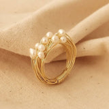 Bague vintage avec nid de perles dorées