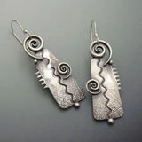 Boucles d'oreilles vintage en argent rectangulaires en spirale