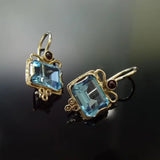 Boucles d'oreilles vintage en or et zircone bleue