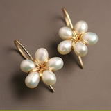 Boucles d'oreilles vintage en or avec fleurs et perles