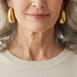Boucles d'oreilles élégantes en or brillant en forme de goutte d'eau