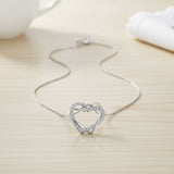 Collier et boucles d'oreilles en diamant en forme de cœur