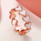 Bague vintage en or rose avec cœur blanc