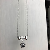 Collier délicat en forme de patte de chien en acier inoxydable