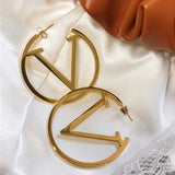 Boucles d'oreilles punk en V en or