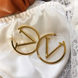 Boucles d'oreilles punk en V en or
