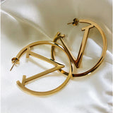 Boucles d'oreilles punk en V en or