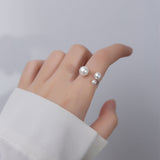 Bague ajustable avec trois perles d'eau douce