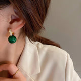 Boucles d'oreilles en perles vertes et or