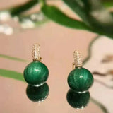 Boucles d'oreilles en perles vertes et or