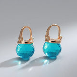 Boucles d'oreilles élégantes en forme de sphère en cristal bleu