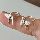 Magnifiques boucles d'oreilles à clip en forme d'hirondelle argentée