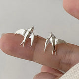 Magnifiques boucles d'oreilles à clip en forme d'hirondelle argentée