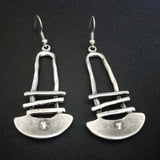 Boucles d'oreilles géométriques en demi-cercle