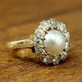 Bague vintage en or avec perle brillante