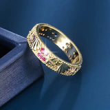 Bague vintage en or avec zircone rouge vif et motif océan