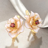 Boucles d'oreilles vintage en émail blanc et or