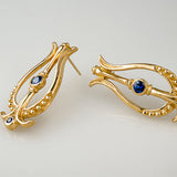 Boucles d'oreilles vintage en or bleu nautilus
