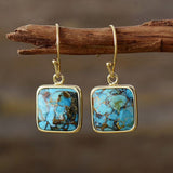 Boucles d'oreilles vintage avec pierre bleue cubique
