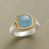 Bague vintage en or et argent avec pierre bleue