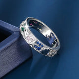 Bague vintage en argent avec zircone bleue et motif océan