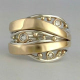 Bague vintage ondulée en or et zircone
