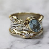 Bague vintage en or et argent avec pierre bleue superposée