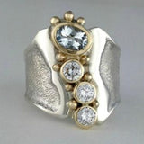 Bague vintage ouverte en argent et or avec cristal
