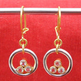 Boucles d'oreilles vintage en or et argent avec trois zircons