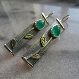 Boucles d'oreilles vintage fleurs avec pierre verte